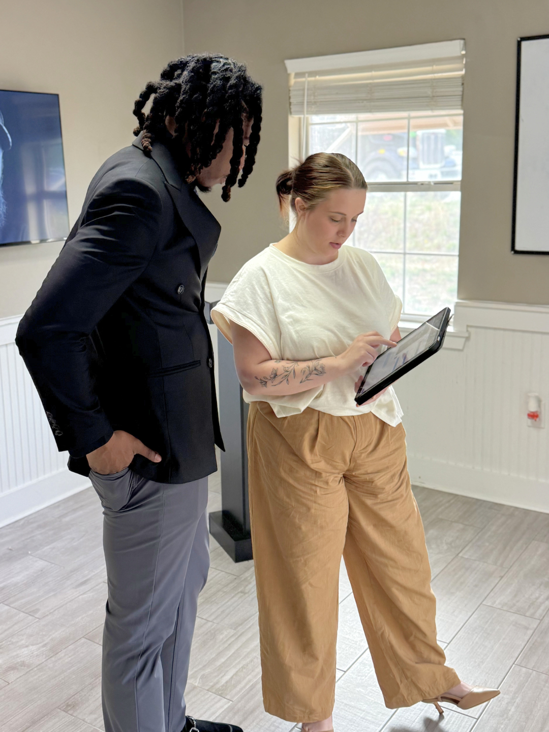 Gold Acquisitions team member consulting with customer